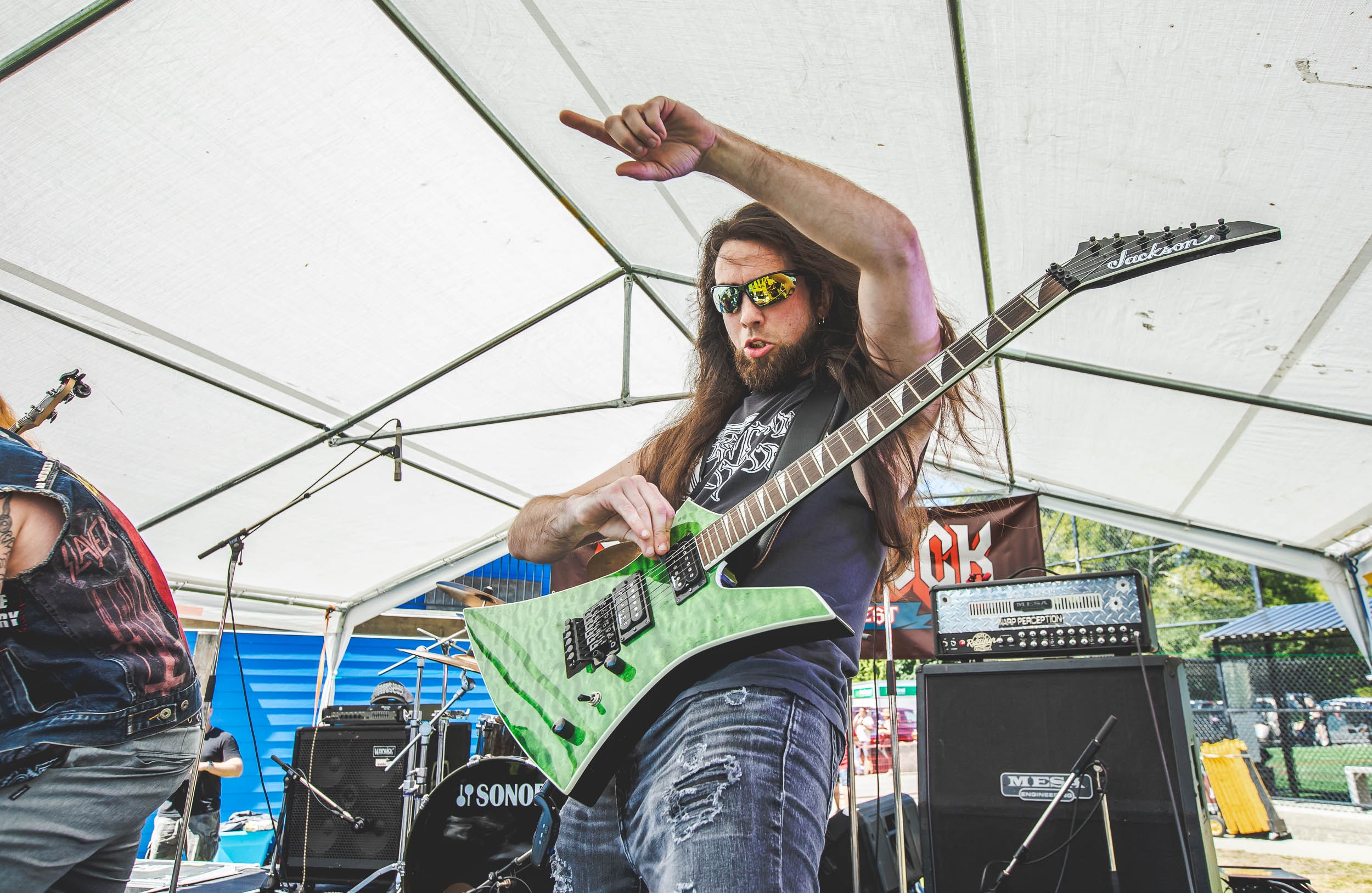 Guitarist shredding on stage at Mosh the Rock