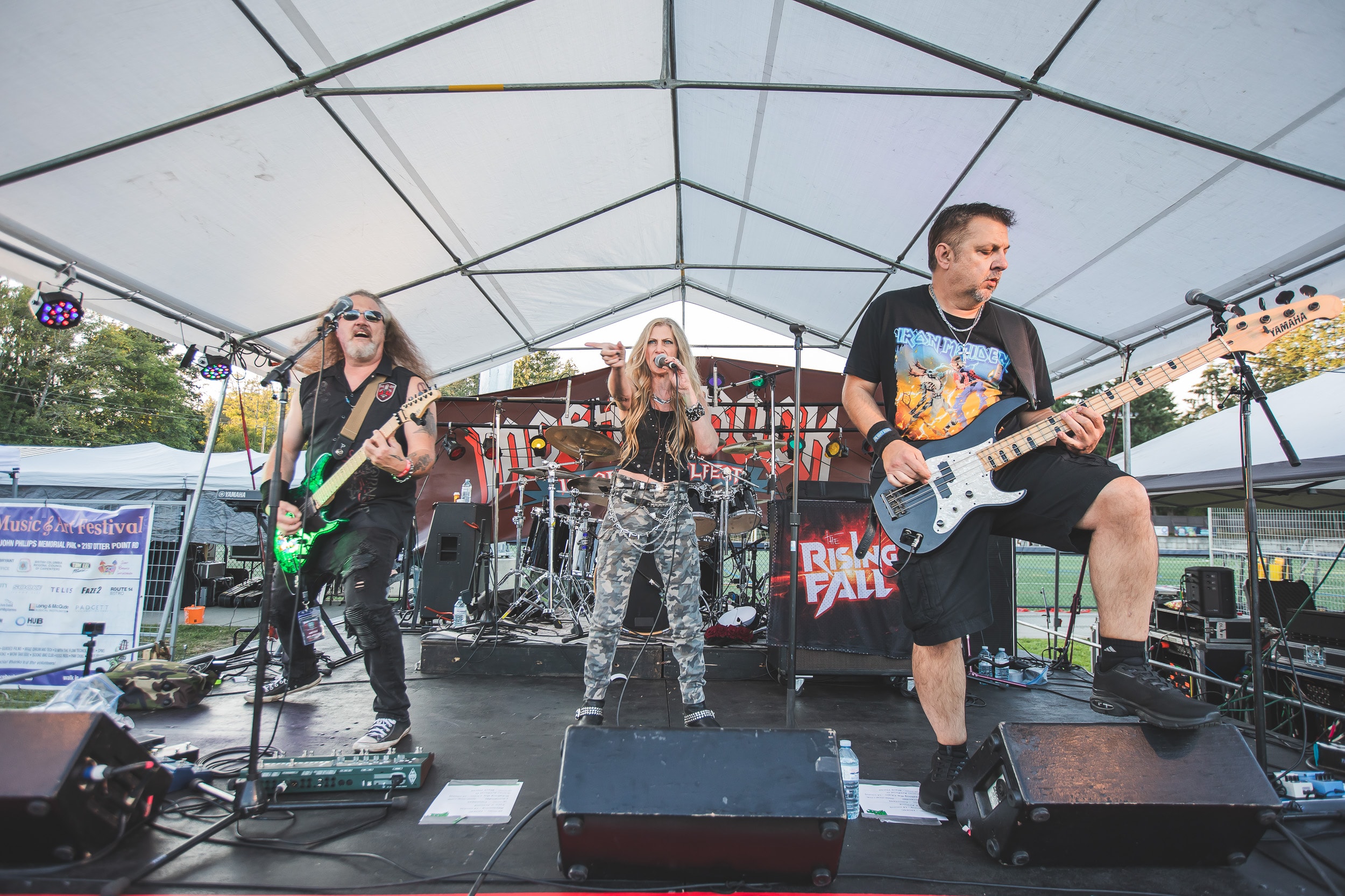 Band performing on stage at Mosh the Rock Island Metalfest